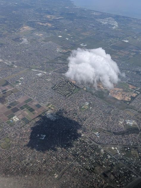 This cloud that's casting a massive shadow on the ground below. Alien Worlds, Album Cover Art, Night City, Aerial View, Funny Photos, Astronomy, Mother Nature, Airplane View, Cosmos