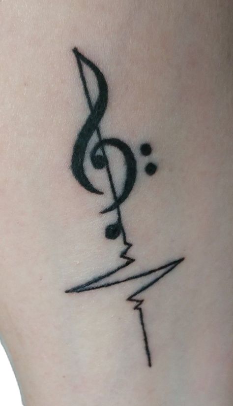 My first tattoo! Guitar Back Tattoo, Emo Music Tattoos, Clarinet Tattoo Ideas, Music Semicolon Tattoo, Music Logo Tattoo, Music Butterfly Tattoo, Marching Band Tattoos, Musician Tattoo Ideas, Orchestra Tattoo