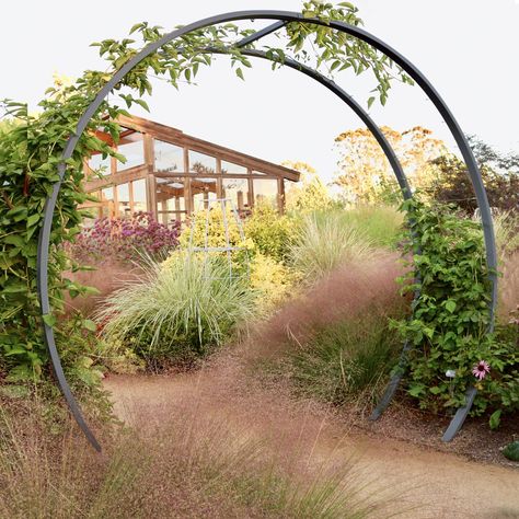 PRICES MAY VARY. EXQUISITE CRAFTSMANSHIP: Elevate your garden with the sculptural artistry of the Gracie Modern Arbor MoonGate Trellis. The modern Arbor is meticulously designed and hand-crafted by artists at the Terra Sculpture studio in Los Angeles, CA. This garden arch trellis seamlessly blends the timeless moon gate aesthetic with contemporary modern garden design, creating a stunning focal point that beautifully supports and complements most climbing plants. DURABLE MODERN LUXURY: Create an Modern Arbor, Steel Arbor, Seed Starting Soil, Living Sculpture, Vine Trellis, Moon Gate, Trellis Ideas, Modern Landscape, Climbing Vines