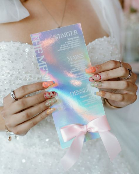 ✨ Just got the gallery back from an incredible holographic and iridescent inspired styled shoot! 🌈💫 The colors, the shimmer, the magic—everything came together so beautifully. I had the absolute joy of creating custom menus that perfectly matched the ethereal vibe of the whole setup. Each menu sparkled with a touch of whimsy, reflecting the light in the most perf way. 🌟🍽️ Seeing my designs come to life in such a dreamy setting was like a fairytale. Imagine this for your big day! 😍 If you're ... Iridescent Themed Wedding, Future Wedding Plans, Menu Cards, Wedding Signage, Menu Design, Wedding Color Schemes, Custom Creations, Place Cards, Custom Wedding