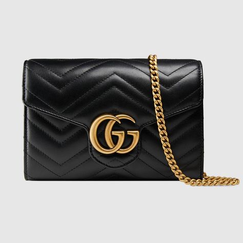 Shop the GG Marmont matelassé mini bag by Gucci. The GG Marmont chain mini bag has a softly structured shape and a flap closure with Double G hardware. The hardware is inspired by an archival design from the '70s. Made in matelassé chevron leather. Gucci Chain Wallet, Gg Marmont Super Mini Bag, Gg Marmont Matelassé Mini Bag, Black Gucci Bag, Gg Marmont Bag, Gucci Gg Marmont Matelasse, Gucci Gg Marmont Mini, Mini Chain Bag, Gucci Mini