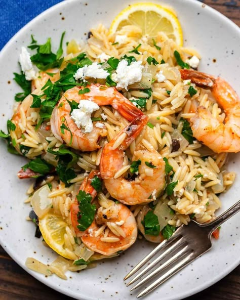 This orzo with shrimp is a delicious one-pot dish that's easy to make and ready in about 30 minutes. Orzo, feta, olives, and fresh lemon zest and juice are tossed with succulent shrimp and finished with fresh parsley. This is a weeknight go-to! #orzo #shrimpandorzo #mediterraneanrecipes Orzo With Shrimp And Feta, Orzo Recipes Healthy, Orzo With Shrimp, Orzo Feta, Shrimp Orzo, Orzo Dishes, Sip And Feast, Lemon Shrimp, Seafood Entrees