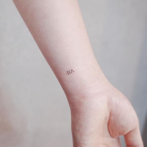 VII tattoo by @wittybutton_tattoo - Tattoogrid.net Vii Tattoo, Roman Numeral Wrist Tattoo, Meaningful Word Tattoos, Roman Tattoo, Roman Numeral Tattoo, Numeral Tattoo, 7 Tattoo, Roman Numeral Tattoos, Small Meaningful Tattoos