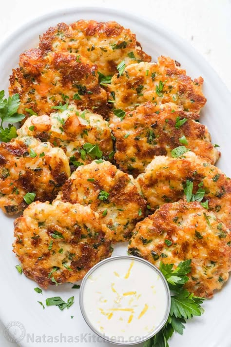 Cheesy Shrimp Cakes aka Shrimp Fritters with irresistible lemon aioli sauce. One of our favorite shrimp recipes! Biting into juicy shrimp, fritter style, is a real treat. The cheese creates an irresistible cheese pull inside and forms a golden crust on the outside. Shrimp Cake Recipe, Precooked Shrimp Recipes, Cheesy Shrimp, Ways To Cook Shrimp, Shrimp Fritters, Cheese Pull, Creamy Shrimp Pasta, Shrimp Cakes, Aioli Sauce