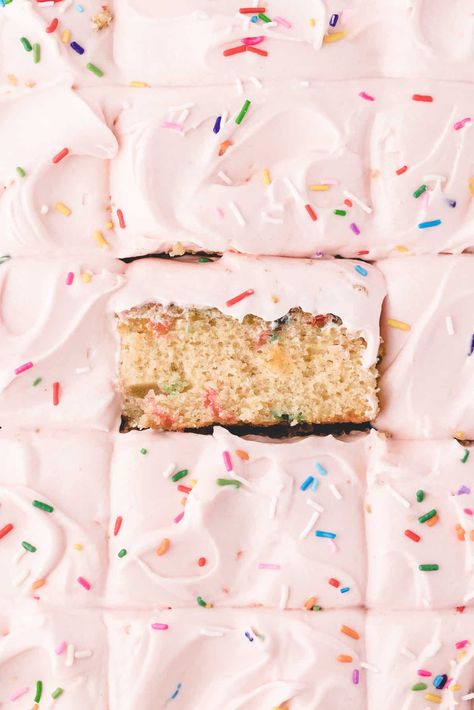 overhead shot of the sheet cake cut into squares with middle square placed on its side. Sprinkle Sheet Cake, Funfetti Sheet Cake, Vanilla Sheet Cake, Strawberry Sheet Cakes, Vanilla Sheet Cakes, Flavored Cream Cheeses, Easy Cake Recipe, Sheet Cake Designs, Strawberry Shortcake Cake