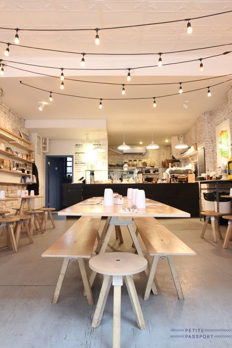 twohandsnewyork1 Shop Lighting Ideas, Communal Seating, Cafe Lamp, Lights Porch, Tristan Eaton, Fun Lighting, Cozy Coffee Shop, Lights Hanging, Coffee Shops Interior