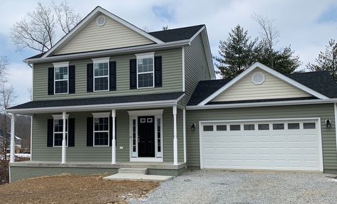 Beautiful craftsman style house with green siding and black shutters. Sage Green House With Black Trim, Green House With Shutters, Green House Black Shutters, Green And Black House Exterior, House With Green Siding, Black Trim House, Light Green Siding, Green House Black Trim, Gray Siding House