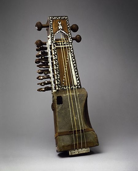 Sarangi, late C19, North India, 61 cm. A sarangi is a bowed stringed instrument with a skin-covered resonator. The typical sarangi is made by hand, usually from a single block of wood. The four playing strings on this instrument are made of goat gut, and the seventeen sympathetic strings are made of steel. The sarangi is used throughout India and has some regional variations, but it is a particularly important part of the Hindustani music of North India. Sarangi Instrument, Indian Instruments, Old Musical Instruments, Indian Musical Instruments, Indian Classical Music, Indian Music, Folk Instruments, Stringed Instruments, Music Instrument