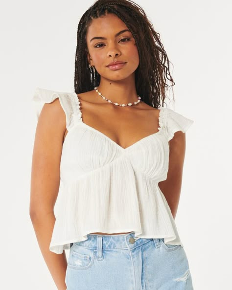 Women's Easy Gauze Babydoll Top | Women's Tops | HollisterCo.ca Baby Doll Shirt, Glow Up Outfits, White Babydoll Top, Teenage Clothing, Clogs Outfit, Babydoll Shirt, Baby Doll Top, Summer Wishlist, Babydoll Tank