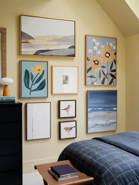 This bedroom features a specific type of gallery wall called a French hang. Instead of just a few pieces of art on a wall, this technique includes an entire wall of art (in this case, floral and landscape artwork) that adds major personality and visual interest. Twin Guest Bedroom, Matching Twin Beds, Hang Gallery Wall, Alison Victoria, Wall Of Art, Hgtv Dream Home, Watercolor Tips, Twin Beds, Good Bones