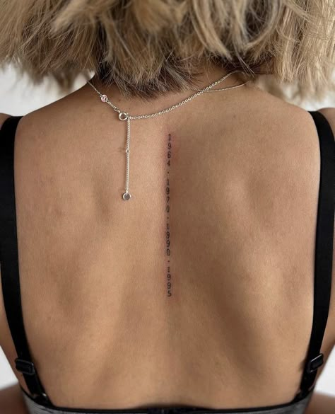 Spine Number Tattoo, Spine Verse Tattoo, Last Name Spine Tattoos, Dates Down Spine Tattoo, Date Spine Tattoo, Perspective Spine Tattoo, Roman Numeral Spine Tattoos For Women, Coordinates Spine Tattoo, Script Hip Tattoos Women