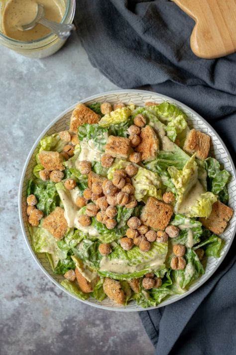 Classic Vegan Caesar Salad served with crispy roasted chickpeas and seasoned croutons. #vegan #saladdressing #caesar #tahinidressing Tahini Caesar Dressing, Crispy Roasted Chickpeas, Oil Free Salad Dressing, Homemade Salad Dressing Healthy, Vegan Caesar Salad, Vegan Caesar, Vegan Lunch Recipes, Croutons Homemade, Healthy Salad Dressing