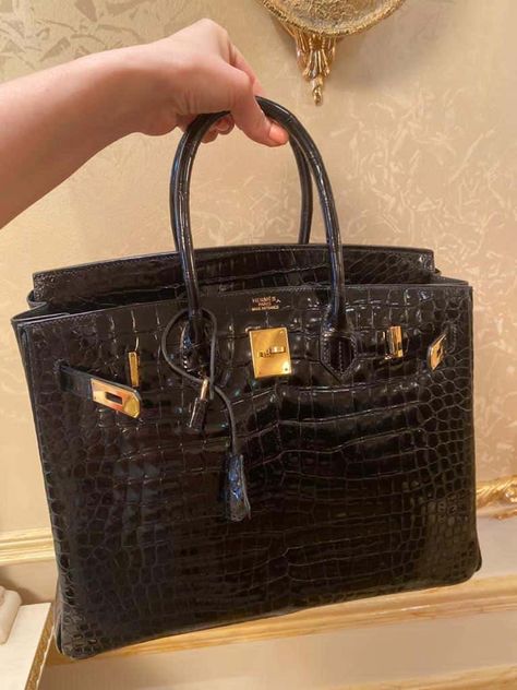 For Sale on 1stDibs - The rich black Hermes Birkin bag in crocodile Lisse skin with lush gold hardware is magnificent with beautiful scales. Perfect for year round wear and Black Hermes Birkin, Black Birkin Bag, Vintage Hermes Bag, Hermes Birkin 40, Hermes Birkin Bag, Being Rich, Expensive Bag, Nate Diaz, Hermes Birkin 35