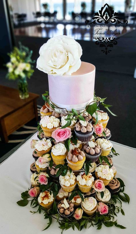 Wedding Cupcake Tower garden theme with pink cake and large flower. roses, vine and peony. chocolate, vanilla and buttercream, beautiful idea for a wedding cake and i loved making it. Designed and Handmade by Custom Cakes and Pastries by Tina Ayer Made in Melbourne Australia www.customcakesan... Facebook: www.facebook.com/... instagram: www.instagram.com... Popular Cakes, Wedding Cupcake Tower, Cupcake Towers, Cupcake Tower Wedding, Donut Display, Cake Tower, Women's Conference, Cakes And Pastries, European Garden