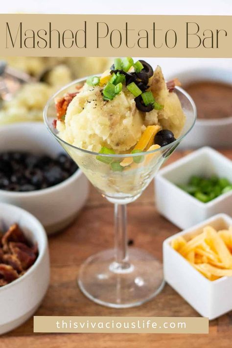 A mashed potato bar and a mashtini is the perfect hearty meal for a large crowd. It's easy to make and everyone loves creamy mashed potatoes combined with their favorite toppings. Martini Mashed Potato Bar, Potatoes For A Wedding, Mash Potato Martini Bar, Mashed Potato Party, Mashed Potatoes Martini Bar, Mashed Potato Bar Wedding Receptions, Mashed Potato Bar Ideas Toppings, Mashed Potato Martini Bar, Mash Potatoes Bar