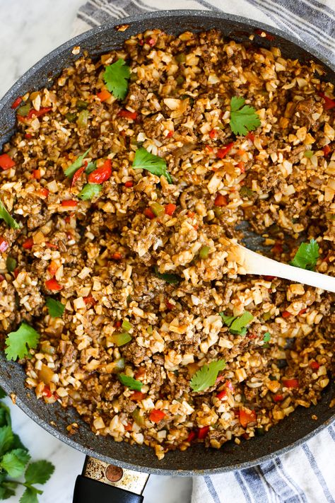 Whole30 Beef Enchilada Skillet - ground beef, onion, green bell pepper, red bell pepper, salt & pepper, tomato paste, chicken broth, chili powder, cumin, garlic powder, onion powder, dried oregano, cayenne, arrowroot (sub xanthan/glucomannan), riced cauliflower, nutritional yeast (optional, for serving), fresh cilantro (for serving) Beef Enchilada Skillet, Whole30 Beef, Enchilada Skillet, The Defined Dish, Defined Dish, Best Enchiladas, Nutritional Yeast Recipes, Yeast Recipes, Beef Enchilada