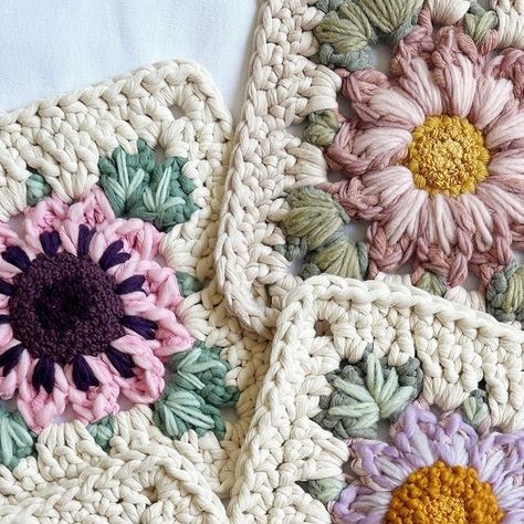 Caroline Langford - Floral Fiber Artist on Instagram: "5 Forever Flower embroidered squares - which is your favorite? 🤩

Each of these are my “Forever Flower” granny square design in 5 mm cotton string, and then I embroidered details with a variety of cotton and wool yarns. I’ll be attaching each of these to dowels so they’ll be ready to bring some flower joy to your homes! 🌸

Love always,
Caroline

#thehappyhomecollective #foreverflowers  #flowerweaving #etsyshop #crochetersofinstagram #floralgrannysquare #flowercrochet #ihavethisthingwithflowers #crochetinspiration #craftinspiration #crochetpattern #bigcrochet" Flower Granny Square Blanket, Floral Granny Square, Daisy Theme, Forever Flower, Flower Granny Square, Crochet Blocks, Fiber Artist, Forever Flowers, Granny Square Blanket