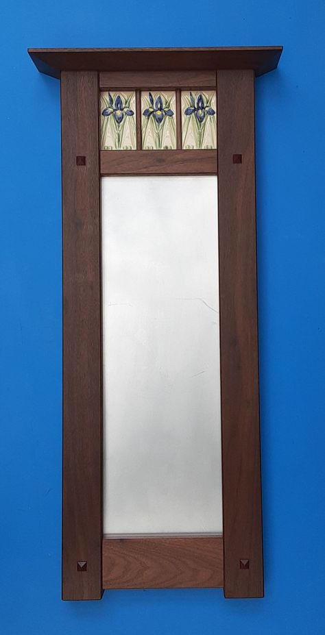 "Iris Tile Decorative Mirror in the Arts and Crafts Style.  This mirror features 3 hand made Iris tiles in a hand crafted Arts and Crafts frame.  The tile is hand painted.  The handmade frame comes in walnut or cherry.  The frame is 31\" tall X 11.5\" wide, the crown is 14.5\" wide X 3\" deep, the mirror measures 7\" X 21\". Allow 3-4 weeks for delivery, if all items are in stock , shipping time will be less. This piece will be a classic, heirloom to treasure in what ever home style you have.  I Arts And Crafts Style Decor, Craftsman Mirrors, Arts And Crafts Bedroom, Craftsman Style Interiors, Craftsman Interior Design, Arts And Crafts Bathroom, Arts And Crafts Tiles, Craftsman Tile, Arts And Crafts Tile