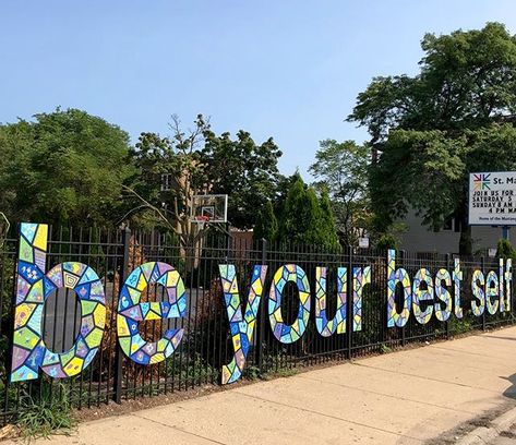 by Matthew Hoffman with the students at St.Matthias, Western & Lincoln, Chicago, ill, 8/18 (LP) Preschool Fence Ideas, School Fence Decorations, School Fence Design, Preschool Designs, Early Childhood Centre, Gate Decoration, Art Studio Organization, Sidewalk Art, School Murals