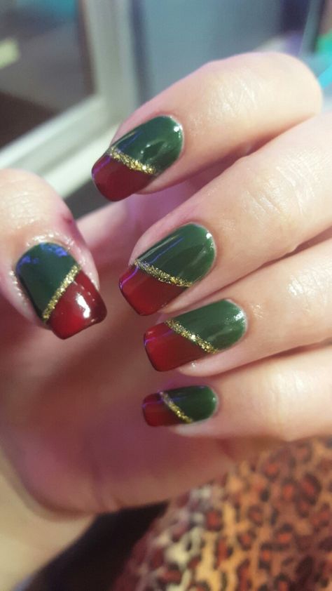 Christmas nails.  Red and green with gold stripe. Green shellac on entire nail, covered with a bright red (shows up darker), and sparkling gold stripe down the middle Green Red Ombre Nails, Green And Red Nail Art, Red Green Nail Art, Red And Green Nail Art, Red Green And Gold Christmas Nails, Christmas Nails Red Green Gold, Burgundy And Green Nails, Christmas Nail Designs Red And Green, Green And Gold Gel Nails