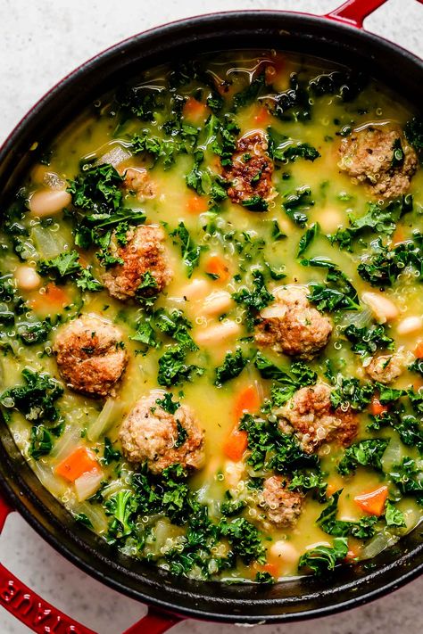 This Italian Wedding Soup with Turkey Meatballs is a flavor-forward & healthy twist on authentic Wedding Soup filled with tender turkey or chicken meatballs, gluten-free quinoa, hearty kale & cannellini beans, & lemon-infused broth. Serve with a spoonful of fresh pesto & savor each sip! Make-Ahead & Freezer-Friendly. Crock Pot / Slow Cooker & Instant Pot Directions Provided. #italianweddingsoup #italianweddingwithturkeymeatballs #healthysouprecipes #soupideas #dinnerideas #dinnerrecipes Kale And Meatball Soup, Turkey Meatball Soup Healthy, Italian Wedding Soup Turkey Meatballs, Soup With Turkey Meatballs, Recipes With Turkey, Soup With Turkey, Soup With Meatballs, Beef And Pork Meatballs, Meatballs Chicken