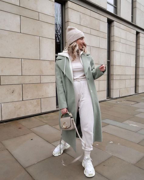 K A T I E P E A K E on Instagram: “These days I am always cosy casual 👟🍈🤍” Sage Coat Outfit, Sage Green Coat Outfit, Sage Trench Coat Outfit, Sage Green Trench Coat Outfit, Light Green Coat Outfit, Knit Coat Outfit, Green Coat Outfit Winter, Light Blue Coat Outfit, Wrap Coat Outfit