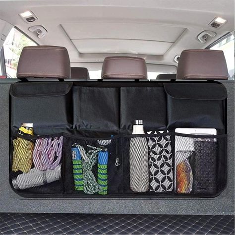 PRICES MAY VARY. Spacious and organized storage: The car trunk organizer hanging size of 40 " length and 18 " width.The car trunk organizer has multiple pockets to keep all your belongings neat and easily accessible Durable and sturdy material: Made of high-quality, reinforced oxford fabric, this car trunk organization is enough strength and durability Easy to install and remove: The trunk backseat organizer simply hang to the headrest with 3 adjustable buckle straps, then attach the opening to Car Decor Backseat, Storage Bags For Car, Small Trunk Organization Car, Toyota Sienna Organization, Suv Accessories For Women, Suv Organization, Trunk Organization Car, Backseat Car Decor, Car Backseat Aesthetic