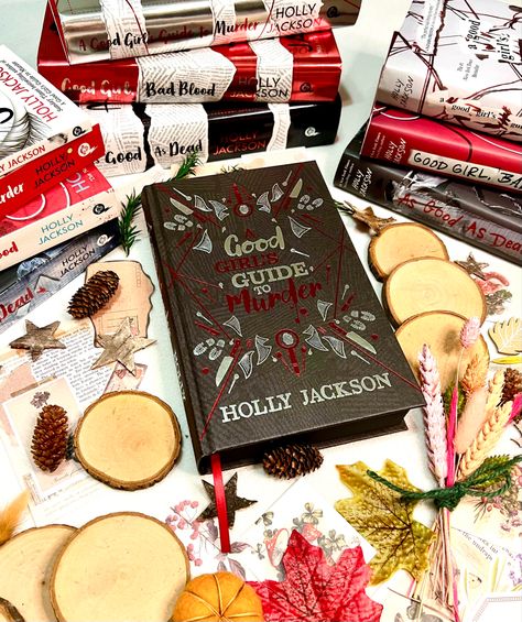 A good girls guide to murder collectors edition surrounded by other copies of the book with autumn decorations surrounding them all Agggtm Special Edition, Agggtm Instagram, Bookstagram Posts, Jackson Bad, Gift Inspo, Bad Blood, Arabic Art, Gaming Room Setup, Ya Books