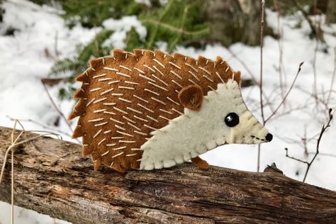 Happy the Hedgehog has been a long time coming. She has been a most popular request since I started sharing my felt ornament designs. We don’t have hedgehogs in the wild in the USA so she was… Felt Turtle, Felt Birds Ornaments, Hedgehog Ornament, Bird Christmas Ornaments, Felt Animal, Felt Embroidery, Felt Jewelry, Animal Patterns, Felt Birds