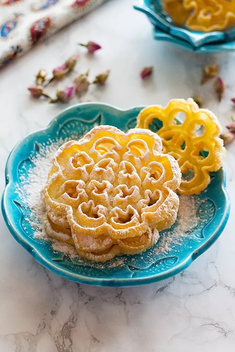 Nan panjereh - Persian rosettes is a traditional Persian cookie that is crisp and light. It's made of basic ingredients and once you find the technique, it is easy and fun to make! #cookies #dessertrecipes Persian Desserts, Rosette Cookies, Iranian Recipes, Persian Cuisine, Iranian Food, Everyday Dishes, Persian Food, Köstliche Desserts, Pastry Recipes