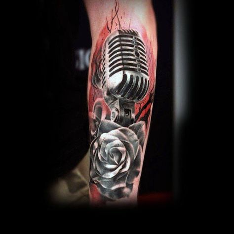 Beautiful Microphone And Rose Tattoo Mens Forearms Rockabilly Tattoo Designs, Tattoo Ideas For Men Forearm, Mic Tattoo, Microphone Tattoo, Music Tattoo Sleeves, Rockabilly Tattoo, Music Notes Tattoo, Music Tattoo Designs, Awesome Tattoo