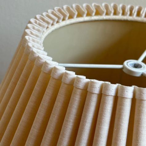 This large mid-20th century scalloped lamp shade is just gorgeous. Love the soft (yet pronounced) rolls wound tightly at the top, yet gently flared toward the bottom rim. This shade features a pretty, soft ivory exterior fabric with a slightly lighter ivory fabric trim. Excellent vintage condition. Beautiful!   The diameter of this shade measures approximately 8” (top) and 18” (bottom). Height measures roughly 12”. Slant height measures 13”. Scalloped Lamp Shade, Scalloped Lamp, Ivory Fabric, Fabric Trim, Lamp Shade, 20th Century, The Top, Rolls, Shades