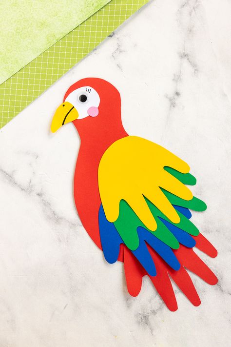 finished paper parrot handprint craft Birds Activity For Preschool, Parrot Craft Preschool, Bird Arts And Crafts, Handprint Parrot, Templates Animals, Paper Parrot, Ara Parrot, Jungle Animal Crafts, Vbs Jungle