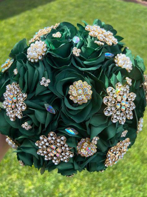 Handmade Quinceañera Bouquet/ Wedding.  With Emerald Roses. Finished off with Gold brooches.  Has extra Brooches, decorative with lace on the bottom, handle with crystal brooch.  *Please note brooches can change in style due to availability.* Decor / color combinations can be changed upon request. {This is a made to order Bouquet} Emerald Green Quinceanera Bouquet, Sage Quince, Emerald Quince, Quince Green, Gold Quinceanera Theme, Emerald Green Quinceanera Theme, Quinceñera Ideas, Green Quinceanera Theme, Emerald Wedding Colors