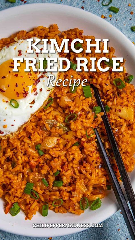 Kimchi Fried Rice in a big white bowl with chopsticks on top. Meals With Kimchi Rice Bowls, Kimchi Fried Rice With Pork Belly, What Do You Eat Kimchi With, Fried Kimchi Rice, Easy Kimchi Fried Rice Recipe, Kim Chee Fried Rice, Kimchee Fried Rice Korean Style, Kim Chee Fried Rice Hawaii, Chicken Kimchi Fried Rice