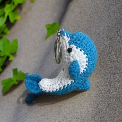 Crochet dolphin keychain, hanging dolphin, Cute dolphin, car hanging, desk decoration, cut #easycrochet, #amigurumi, #stuffedanimals, #smallcrochetprojects, #kawaiicrochet Crochet Dolphin Keychain Pattern Free, Crochet Heart Bag, Dolphin Crochet, Crochet Dolphin, Dolphin Keychain, Hanging Desk, Crochet Projects To Sell, Crochet Butterfly Free Pattern, Dolphin Decor