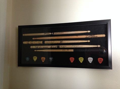 Drumstick display Drum Stick Display, Music Memorabilia Display Ideas, Guitar Pick Display, Concert Memorabilia Display, Concert Display, Drumstick Display, Cascading Planter, Repurposed Guitar, Rock And Roll Room