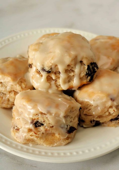 Try my Better Than Hardee's Cinnamon Raisin Biscuits for soft, buttery, flaky biscuits full of sweet, plump raisins, cinnamon sugar, and topped with a delicious vanilla glaze. These homemade cinnamon raisin biscuits are so easy to make with self rising flour and so good! Hardees Cinnamon Raisin Biscuits Recipe, Bojangles Cinnamon Biscuits Recipe, Copycat Hardees Cinnamon Raisin Biscuits, Sweet Breakfast Biscuits, Hardee’s Biscuits, Cinnamon Raisin Biscuits Hardees, Hardee’s Cinnamon Raisin Biscuits, Hardees Cinnamon Raisin Biscuits, Cookies With Self Rising Flour