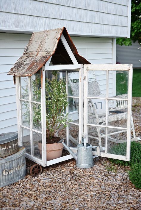 DIY window greenhouse - See how to make this amazing rustic greenhouse. A super easy DIY project that adds rustic charm indoors or outdoors. A great pin for DIY farmhouse decor! Diy Window Greenhouse, Old Greenhouse, Rustic Greenhouses, Greenhouse Diy, Window Greenhouse, Diy Greenhouse Plans, Country Garden Decor, Indoor Greenhouse, Backyard Greenhouse