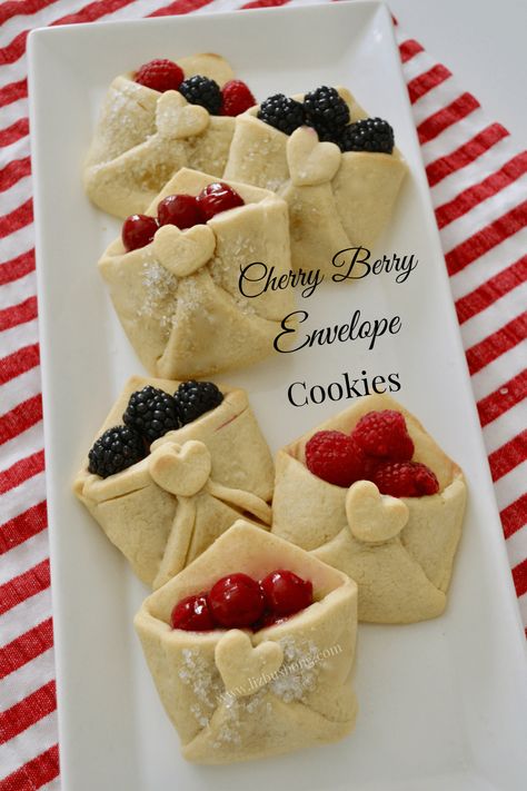 How to make Cherry Envelope Cookies lizbushong.com, Butter sugar cookies are shaped like an envelope love note and filled with cherry pie filling or fresh berries. Get recipe and how to make at Lizbushong.com. The original Cherry Pie Pastry note Creator turns pastry to cookies. Mini Cherry Tarts, Cherry Pie Cookie Cups, Cherry Tarts Mini, Envelope Cookies, Cherry Pie Tarts Mini, Valentine Envelope Cookies, Cherry Baby Shower Cookies, Rolled Sugar Cookie Dough, Pie Pastry