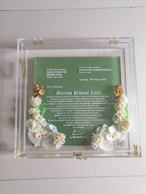 𝐄𝐍𝐆𝐀𝐆𝐄𝐌𝐄𝐍𝐓 𝐋𝐄𝐓𝐓𝐄𝐑𝐒 🌸 Check out this beautiful Luxury Acrylic Letter. Book Yours Now and Stand out in style Love. Abby The Eruiyawo Specialist Remember Wash and Pray 🙏 ---------------- We create Art pieces ✅ ----------------- We mean it when we say we got you covered. .... Let's package it with love and seal it with a bow 🎀 🎁❤️ #eruiyawobyabby #eruiyawoexperience #eruiyawo #engagementgift #engagementletter #bellanaijaweddings #yorubaweddings Engagement Letter, Letter Book, Proposal Letter, Yoruba Wedding, Engagement Proposal, Acrylic Letters, Kitchen Tables, Bella Naija Weddings, Proposal Engagement