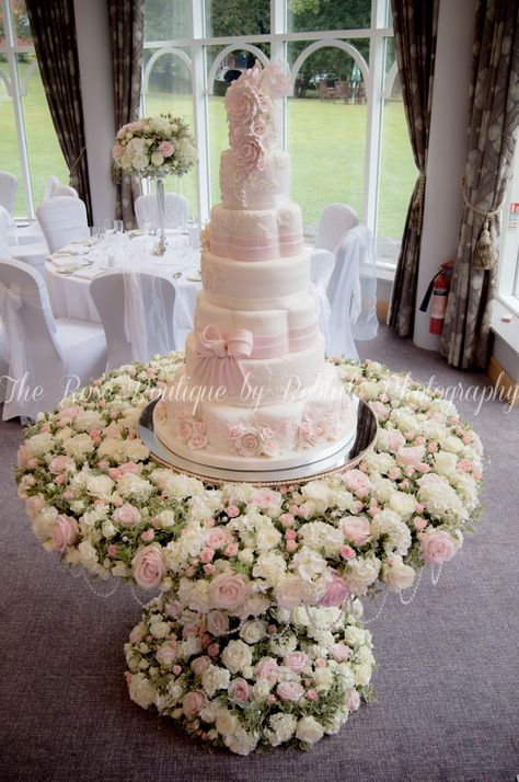 A stunning flower covered cake table for a stunning wedding cake! Cake Table Design, Princess Quince, Sparkly Wedding Cakes, Cherry Blossom Centerpiece, Southern Praline, Champagne Wedding Cakes, Cake Bride, Wedding Cake Display, Cake Tables