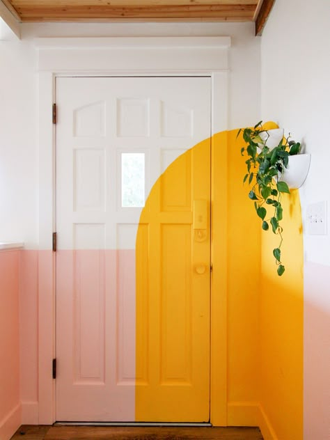 4 Paint Projects That Took This Muralist’s Home from All-Gray to Technicolor Funky Door Paint Ideas, Unique Painted Doors Interior, Retro Painted Wall Mural, All White Interiors, Design On Walls With Paint, Entryway Mural Ideas, Entryway Mural Wall Art, Painted Panel Walls, Hallway Mural Ideas