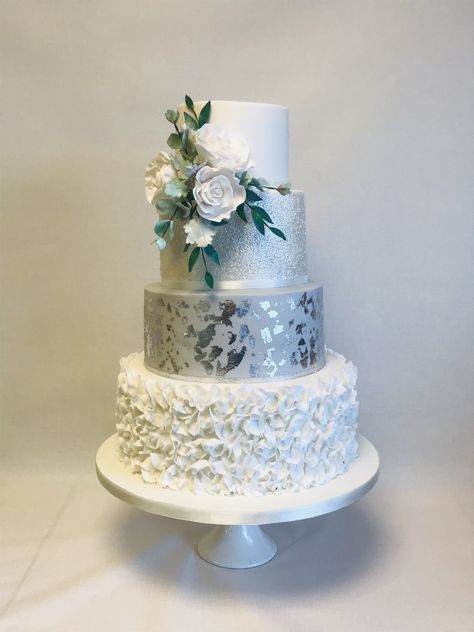 Rachael, 4 tier wedding cake with grey and silver with white colour theme featuring a spray of white sugar roses and winter foliage Wedining Cake, Wedding Cake 4 Tier, 25 Anniversary Cake, 4 Tier Wedding Cake, Rainbow Board, Silver Wedding Cake, Winter Foliage, 18th Bday, 16th Anniversary