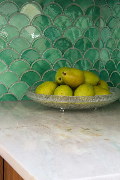 Kitchen Makeover with Green Fish Scale Tile Backsplash. Sea Mist Mercury Mosaics Backsplash Tile. Iittala Ultima Thule Fruit Bowl. Quartzite Counters. Mid-century kitchen renovation - CHECK OUT THE BLOG for the kitchen renovation reveal. Bold backsplash ideas; kitchen backsplash ideas; kitchen backsplash design. Kitchen backsplash with wood cabinets. Backsplash With Wood Cabinets, Kitchen Backsplash With Wood Cabinets, Fish Scale Backsplash, Fish Scale Tile Backsplash, Bold Backsplash, Quartzite Counters, Scale Tile, Moroccan Fish Scale, Backsplash Design