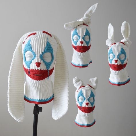 Crochet creepy clown balaclava ski mask with bunny ears made to order from cotton yarn. Entirely handmade. Suitable for men and women. Knit face mask with 3 holes white color #01, mouth and eyebrows red color #90, eyes and triangles turquoise color #55, according to the color chart in the last image.  The personalization and handwork make each piece unique.           Sizes: M- 22" - 22 3/8" (55.9 cm-56.8 cm) L- 22 3/4"-23 1/8" (57.8 cm-58.7 cm) XL- 23 1/2"-23 7/8" (59.7 cm-60.6 cm) XXL- 24 5/8"- Ski Mask Crochet, Crochet Creepy, Mask Crochet, Hat Outfits, Crochet Mask, Scary Funny, Knitted Balaclava, Creepy Clown, Crochet Clothing And Accessories