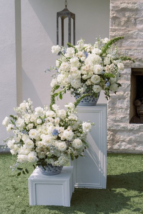 White and blue wedding ceremony flowers. French Blue and white classic wedding at the Arlo in Austin Texas. Film Wedding Photography White Wedding Scheme, Wedding Florals Blue And White, White Flowers With Blue Accents, Blue And White Ceremony Flowers, Blue And White Aisle Flowers, French Wedding Ceremony, Blue And White Floral Arch, French Blue And White Wedding, Southern Elegance Wedding