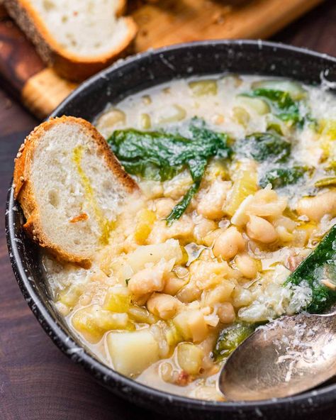 Escarole and bean soup with pancetta, potatoes, and cannellini beans is easy to make and budget-friendly. Served in bowls with a drizzle of extra virgin olive oil, some grated Parmigiano Reggiano, and crusty bread, this is a meal you'll want to make all winter long. #escaroleandbeans #whitebeanescarolesoup #beansandgreens Italian Escarole And Bean Soup, Bean And Escarole Soup, Escarole And Bean Soup, Escarole And Beans, Escarole Recipes, Bean Ideas, Escarole Soup, Cannellini Beans Recipes, Soup Italian