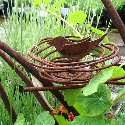 Pin by Tamara Radcliffe on metal yard art | Metal garden art, Rusty ... Rusty Metal Garden Art, Rock Path, Barbed Wire Art, Yard Art Crafts, Rusty Garden, Metal Sculptures Garden, Plant Stakes, Bird Bath Garden, Metal Tree Wall Art