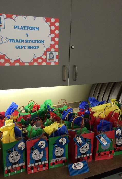 Favor bags at a Thomas The Train party Thomas Train Birthday Party, Tomas Train Party Ideas, Train Party Bags, Thomas The Train Party Favors, Thomas The Train Second Birthday Party, Train Birthday Party Favors, Railroad Birthday Party, Thomas & Friends Party Ideas, Thomas 3rd Birthday